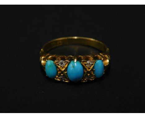 An 18ct gold turquoise and diamond gypsy ring, set with three oval cut turquoise stones, and four round brilliant cut diamond