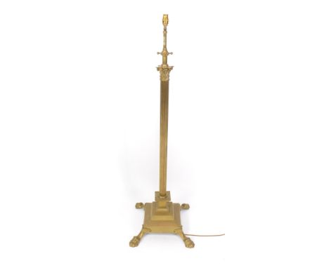 An Edwardian Corinthian columnar telescopic standard lamp, on a stepped base terminating in hairy paw feet, 143cm high.