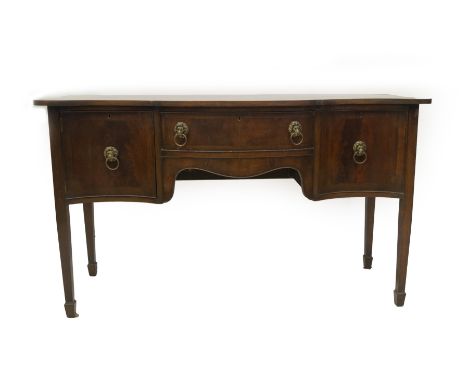 A Regency mahogany serpentine sideboard, with plain top, frieze drawer over apron, enclosed by cupboard to left and cellaret 