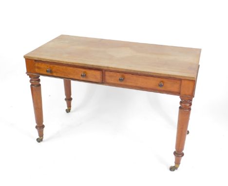 A Victorian mahogany writing table, in the manner of Holland &amp; Sons, with replacement top, two frieze drawers with button