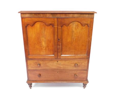 An early 19thC flame mahogany linen press, the outswept pediment over two panelled doors, enclosing a single fixed shelf, ove