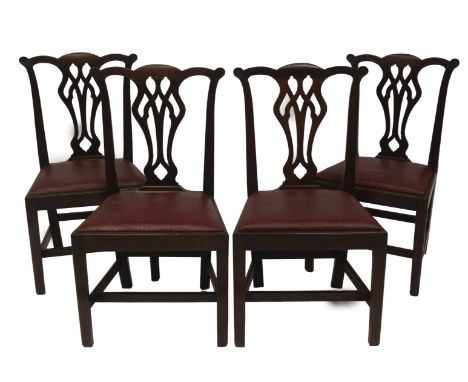 A set of four late 19thC mahogany dining chairs, in the Chippendale manner with pierced vase splat, drop in seats, plain legs