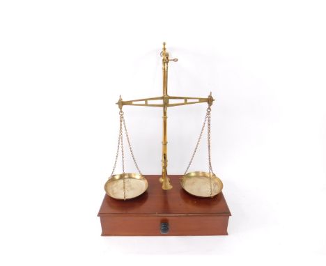 A set of W &amp; T Avery Limited brass scales, to weight up to 50 ounces, raised on a mahogany box base, with single frieze d