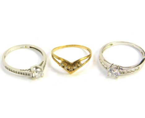 Three 9ct gold and zircon set rings, size O,Q and T, 5.8g.