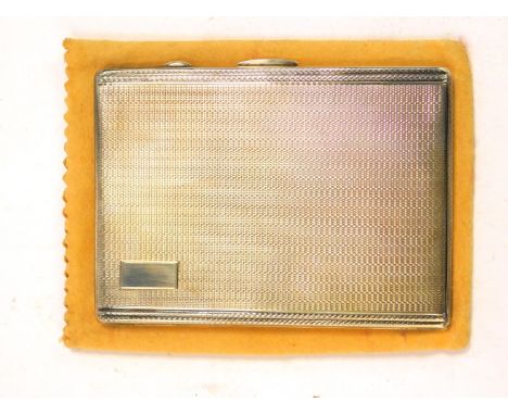 A George VI silver cigarette case, with engine turned decoration, with outer slip case, Birmingham 1946, 5.28oz.