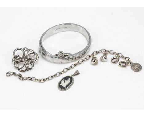 A silver Mont Blanc hinged bangle, of oval shape, internal measurements 6cm x 4.8cm, together with a pair of Links hearts ear
