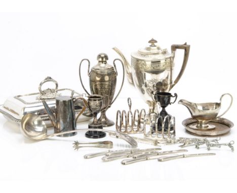 A collection of silver plate, including five butter knives with silver handles, a soup ladle, a Sheffield plate wine bottle c