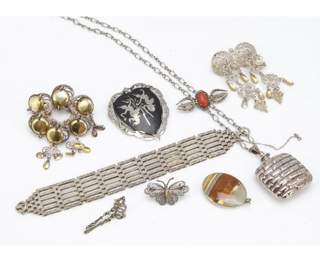 A quantity of silver jewellery, including a gate bar bracelet, coral and silver brooches, continental silver brooches and oth