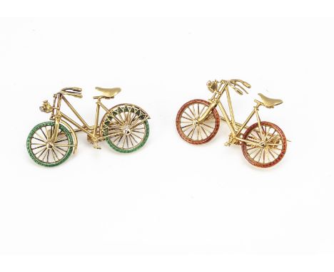 Two 18ct gold enamel and gem set bicycle brooches, with red and green enamel wheels having rough cut diamond set bicycle lamp