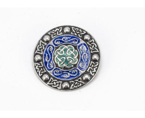 A silver and enamel Celtic brooch, in the manner of Alexander Ritchie, 3.7cm diameter, 15.2g