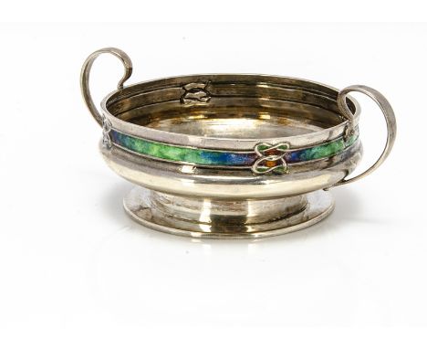 Important Announcement - Please note the estimate has been revisedAn Edwardian Arts & Crafts silver and enamelled twin handle