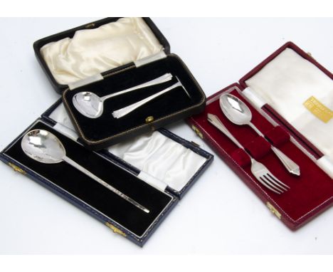 A 1960s silver feeding set, in case, together with a cased silver christening spoon and fork set and a modern silver replica 