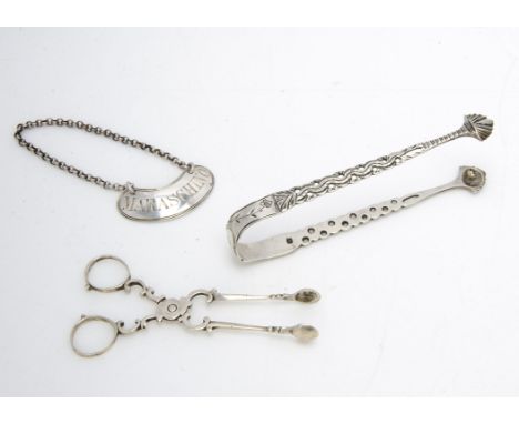 A Victorian silver Maraschino decanter label, by WS, together with a pair of George III silver pierced sugar tongs and a simi