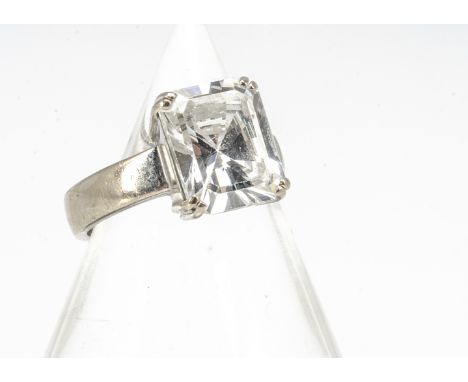 An 18ct white gold zircon dress ring, with baguette cut claw set colourless zircon, in thick white gold band, ring size K 1/2