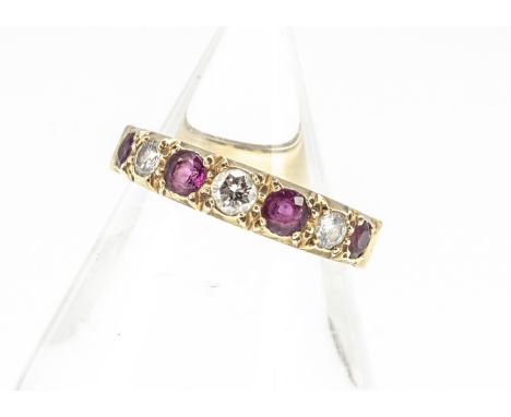 An 18ct gold ruby and diamond seven stone half hoop eternity ring, the brilliant cuts set with round rubies in sunken setting