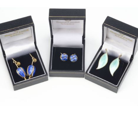 Three pairs of silver gilt and enamel Scandinavian earrings, two of floral design and one pair of knotted studs