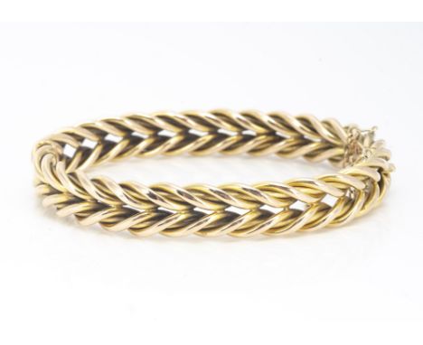 A 9ct gold plaited link bangle of oval shape, 5.8cm x 4.8cm, 20g