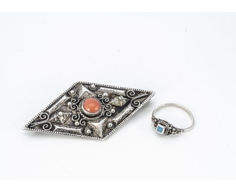 An Italian white metal and coral lozenge shaped brooch, with applied wirework decoration, 6cm x 3.4cm together with a silver 