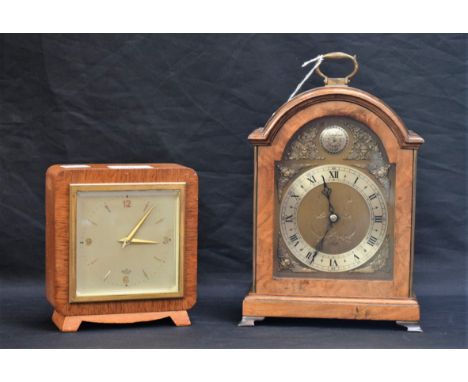 A walnut Elliot bracket clock, the silvered chapter ring with Roman and Arabic numerals, brass loop carry handle, bracket fee