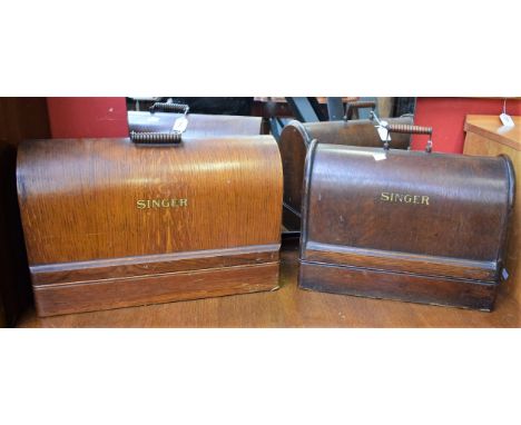 An early 20th century hand crank singer sewing machine; another similar (2)