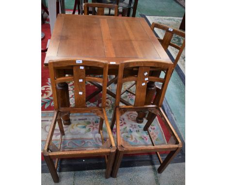 A light oak drawleaf dining table; a set of four conforming dining chair frames (5)