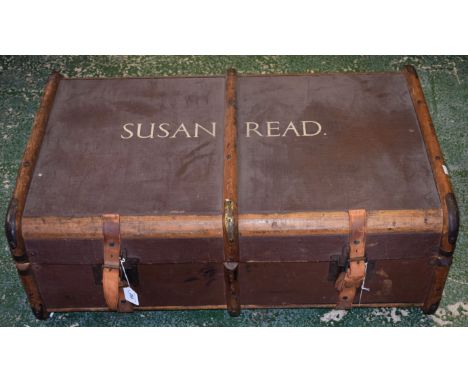An early 20th century wood bound trunk with leather straps and handles, painted name to cover 'Susan Read'.