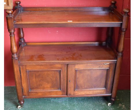 A Victorian mahogany buffet, the two tiers with three quarter galleries, turned pillars and finials, the base with a pair of 