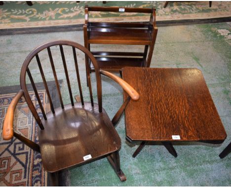 An Ercol style child's rocking chair; a 20th century oak occasional table; a 20th century mahogany floor standing bookshelf, 