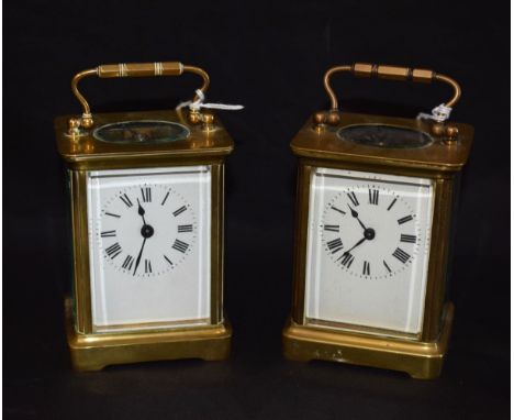 An early 20th century carriage clock timepiece, Roman numerals, four glass case, 14cm high overall; another, similar, both wi