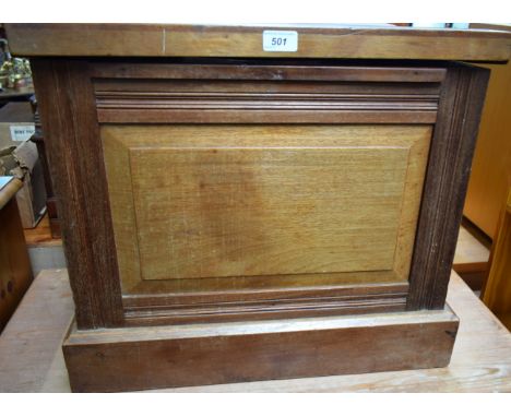An early 20th century mahogany commode, the hinged cover enclosing an enamel chamber pot, 57cm wide