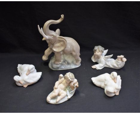 A Nao model, of an Elephant with raised trunk; other Nao figures, a pair of groups of ducks, a putto; a Lladro Putto (5) 