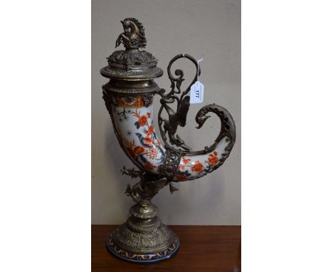 A reproduction 19th century style cast metal mounted ceramic drinking horn, printed and painted in the Imari palette, the mou