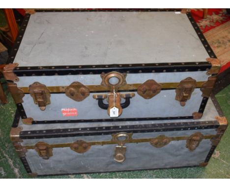 A metal bound Overpond travelling trunk, 91cm wide; another, smaller, 75cm wide (2)