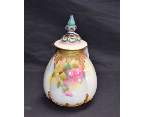 A Royal Worcester vase and cover, typically painted with roses and picked out in gilt