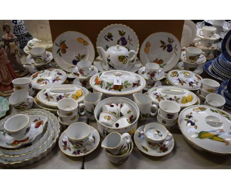 A Royal Worcester Evesham pattern six setting part tea and dinner service, comprising dinner plates, side plates, cups, sauce