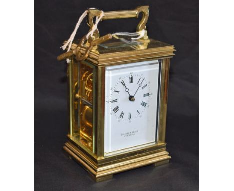 A lacquered brass carriage clock, white rectangular enamel dial, Roman and Arabic numerals, Taylor &amp; Bligh, Worcester, 17