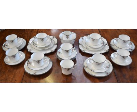 An Art Deco tea service, decorated with Arabesque, comprising bread plates (2), milk and sugar, tea cups, saucers and side pl