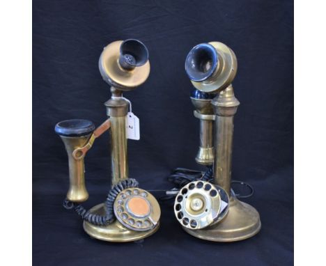 A pair of Edwardian style brass candlestick telephones