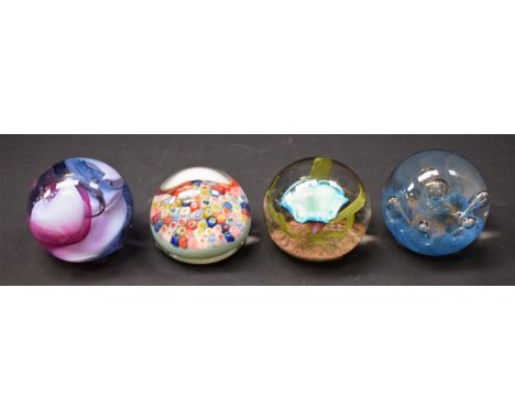 A Caithness paperweight, Neon; two others, similar, Seadance and Caprice; a millefiori paperweight (4)