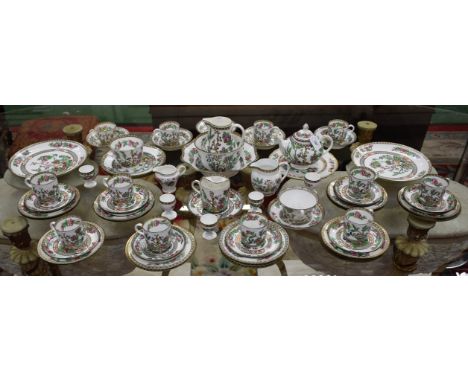 An Indian Tree pattern part tea service, comprising cups, saucers, moustache cup and saucer, side plates, teapot, milk jug, s