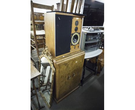 CIRCA 1930's TWO DOOR FIGURED WALNUTWOOD RECORD STORAGE CABINET WITH PLINTH BASE (INTERIOR DIVISIONS REMOVED) AND A SPEAKER A