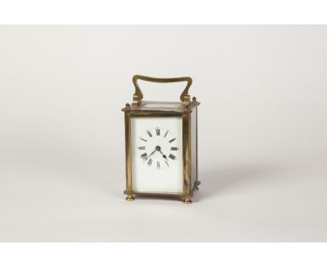 LATE  NINETEENTH/EARLY TWENTIETH CENTURY BRASS CASED CARRIAGE CLOCK, of typical form with top carrying handle, oblong top gla