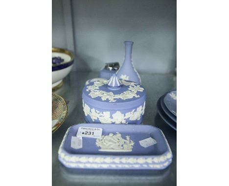 WEDGWOOD PALE BLUE AND WHITE JASPERWARE LARGE CIRCULAR BOX AND COVER; A SMALLER BOX AND COVER; A VASE; A TABLE LIGHTER; A PAI