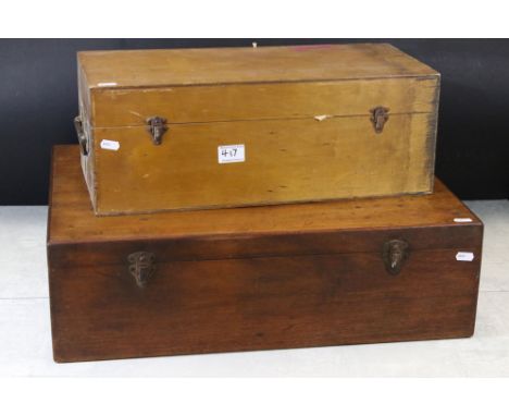 A collection of glass scientific instruments and containers within two fitted wooden cases. 