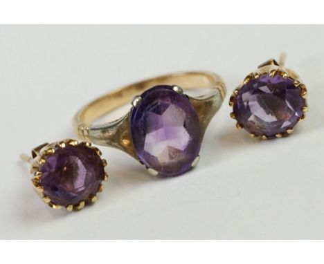 A yellow metal amethyst set dress ring together with earrings. 