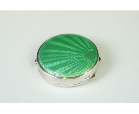 A fully hallmarked sterling silver and enamel Art Deco powder compact with green guilloche decoration, assay marked for Birmi