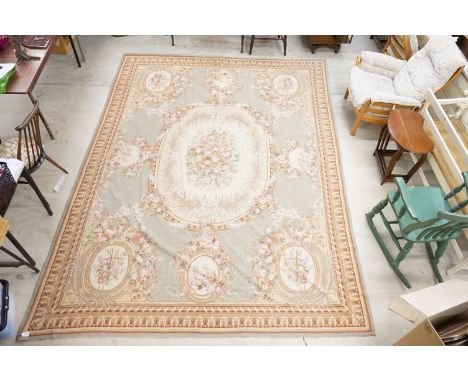 Large French  Aubusson style Tapestry, the green ground with panels of floral sprays within a stylised leaf border, 363cm x 2