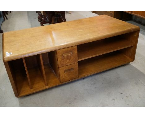 Mid century Meredew Teak Rectangular Coffee Table with open shelves and two drawers raised on castors, 121cm long x 61cm wide