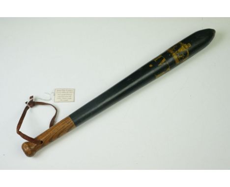 Wooden police truncheon with painted 'William IV' initials and crown, on a dark blue painted ground, with leather strap. Meas