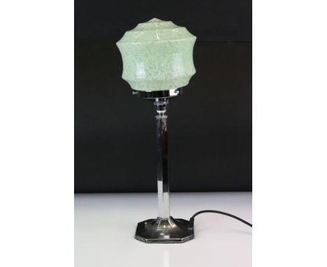 Art Deco chrome table lamp with mottled green glass shade, above a hexagonal column on an octagonal base. Measures 49cm high 